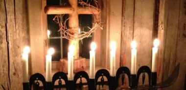 an image of a candlelit communion table