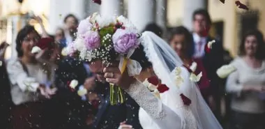 view of couple leaving their wedding